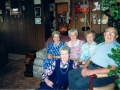 Left to right on couch: Edna, Eva, Lois, Holley. Wanda on floor. Grandma party at Marie's 1982.