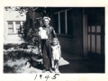 Rondo holding Dixie with Karen standing next to him. 1945.